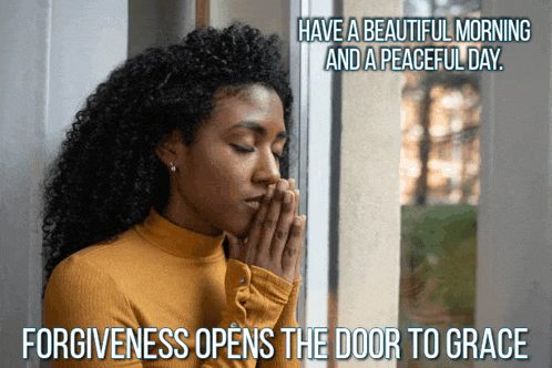 a woman is praying in front of a window with the words have a beautiful morning and a peaceful day
