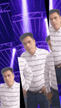 a man in a striped shirt is standing in front of a purple light