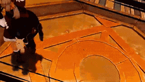 a video game character is standing on a circular floor
