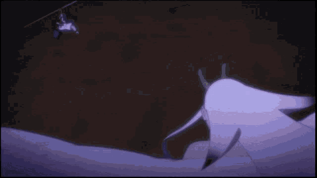 a person with horns and white wings is fighting another person