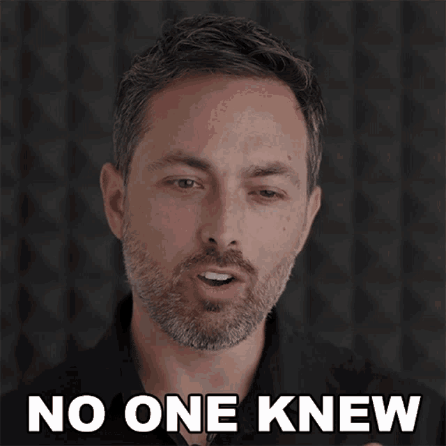 a man with a beard says " no one knew " in front of a black background
