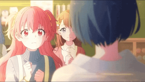 a girl with red hair is looking at another girl with blue hair