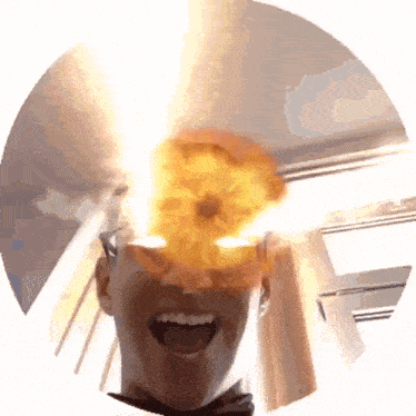 a man is laughing with a fireball coming out of his head