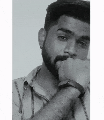 a black and white photo of a man with a beard