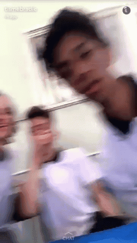 a blurry picture of a man 's face with the word chat on the bottom left
