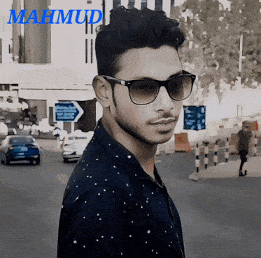 a man wearing sunglasses with the name mahmud on the bottom