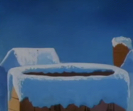 a cartoon cat wearing a santa hat is sitting on top of a snow covered ice cube .