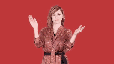 a woman with her arms outstretched is wearing a kimono