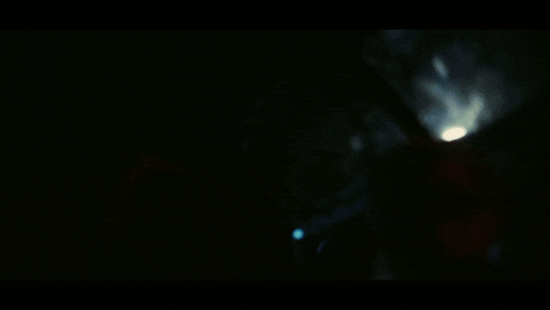 a blurry picture of a dark room with a few lights