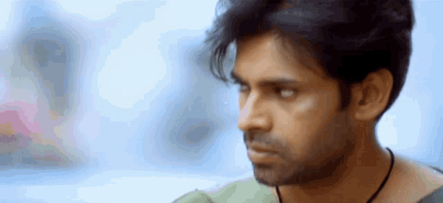 a close up of a man 's face with his eyes closed