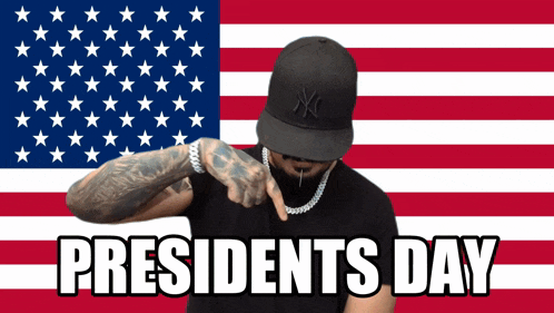 a man wearing a ny hat points to his arm in front of an american flag with the words presidents day below him