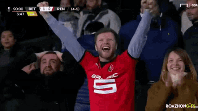 a man wearing a red jersey with the number 5 on it