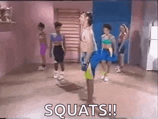 a group of people are doing squats in a gym with the words squats !