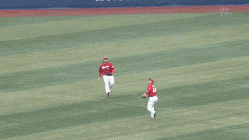 a baseball player wearing a red uniform with the letter c on it