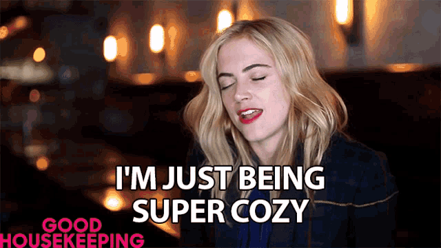 a woman says i 'm just being super cozy in a good housekeeping ad