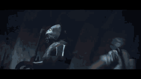 a man in a mask is holding a woman in his arms .