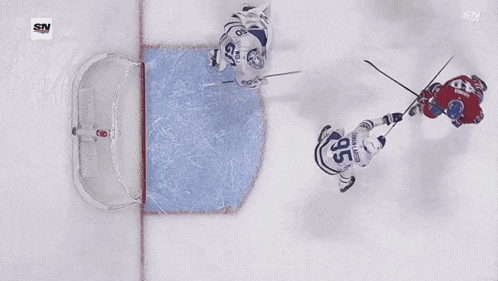 a hockey player with the number 56 on his jersey is falling