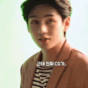 a man wearing a striped shirt and a brown jacket is looking at the camera .