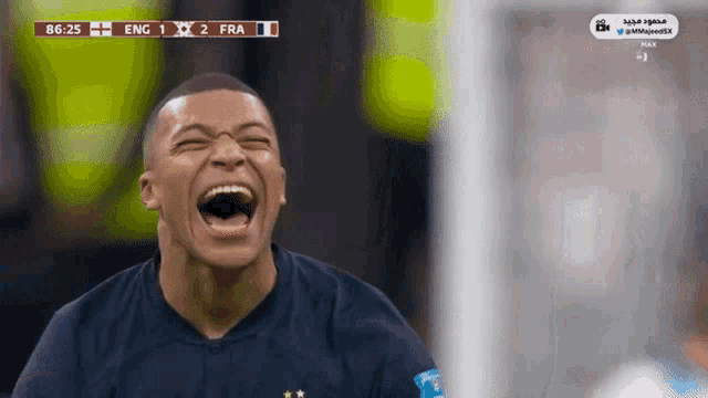 a soccer player is laughing during a game between france and the uk