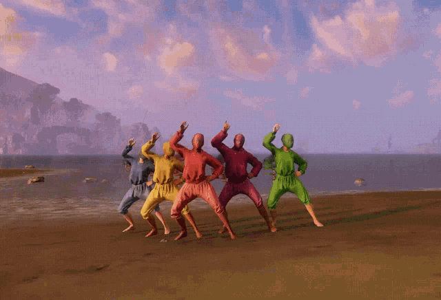 a group of people in different colors are standing on a sandy beach