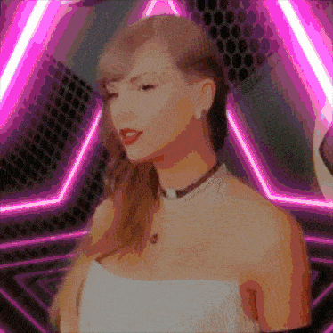 a woman in a white dress is standing in front of a pink triangle
