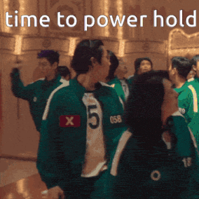 a group of people are standing in a room with the words time to power hold written above them