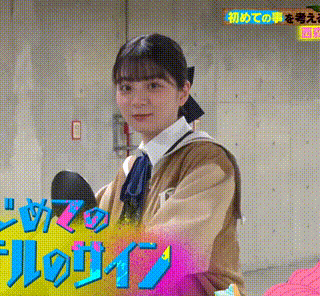 a girl in a school uniform is holding a pair of shoes and looking at the camera .