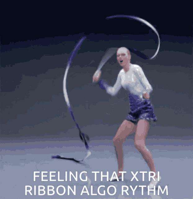 a woman is dancing with a purple and white ribbon and the caption says feeling that xtri ribbon algo rhythm