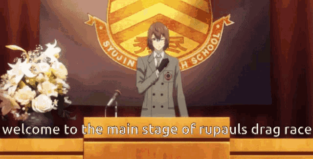 a man stands behind a podium with the words welcome to the main stage of rupauls drag race