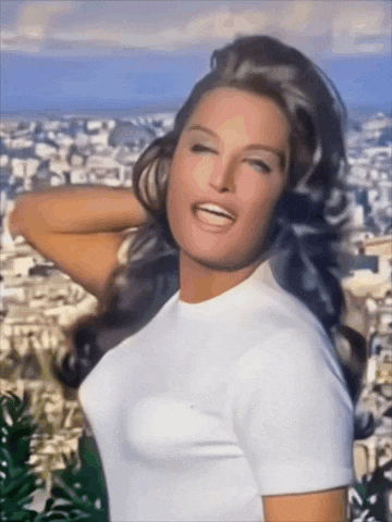 a woman in a white t-shirt is smiling and looking at the camera