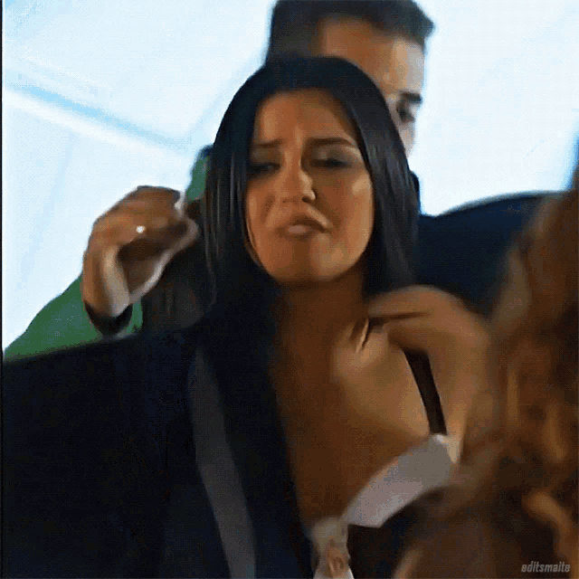 a woman in a black bra is being touched by a man with editzmalte written on the bottom right