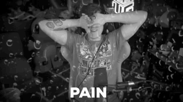 a black and white photo of a man with the word pain written on the bottom