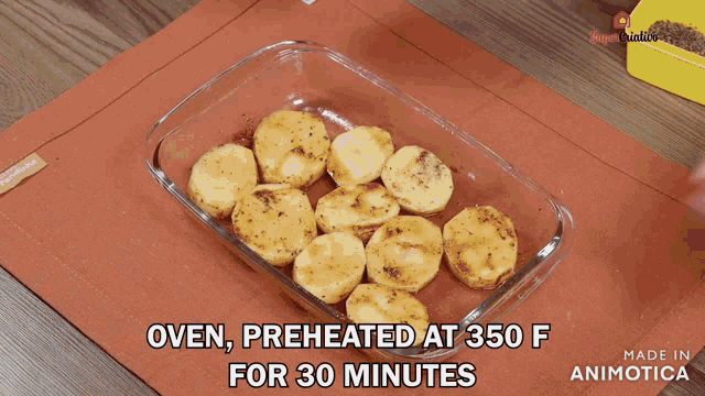 a glass container filled with sliced potatoes says oven preheated at 350 degrees for 30 minutes