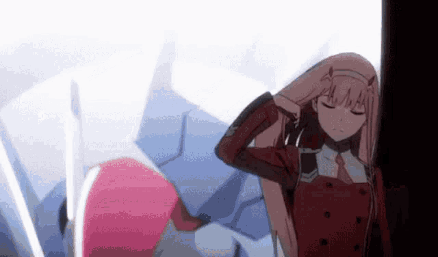 a girl with pink hair is standing next to another girl in a red dress .