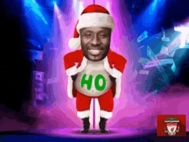 a man in a santa suit is holding a sweater that says ho on it