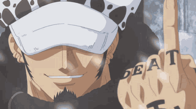 a man wearing a hat and a tattoo on his finger that says deat