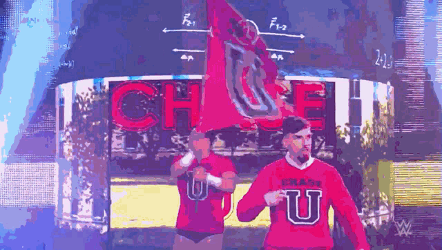 a man in a chase u shirt is holding a flag