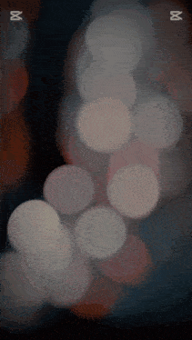 a blurred image of a bunch of circles with the letters m on it