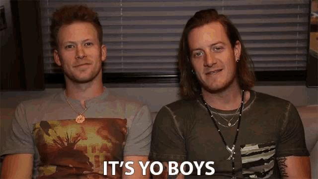 two men sitting next to each other with the words it 's yo boys on the bottom right