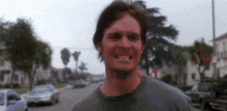 a blurry picture of a man with a red face
