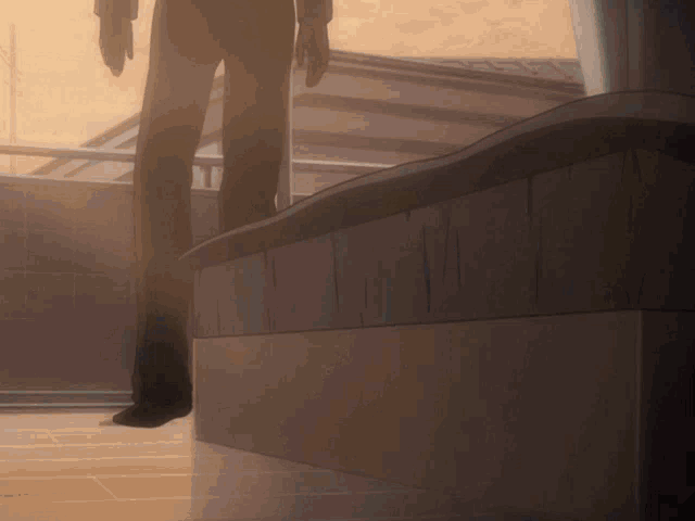 a man in a suit stands on a balcony