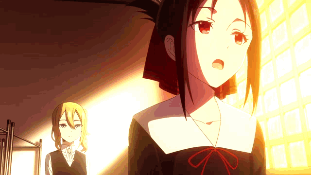 two anime girls are standing next to each other