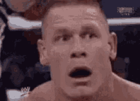 a close up of a man with his mouth open .