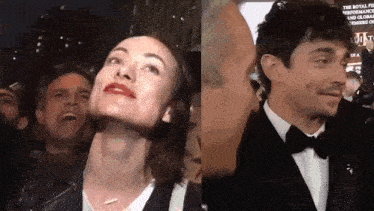 a man and a woman are standing next to each other and the woman is smiling