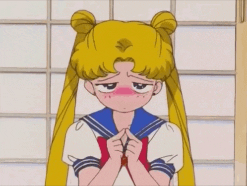 a cartoon of a girl with buns on her hair covering her face with her hands .