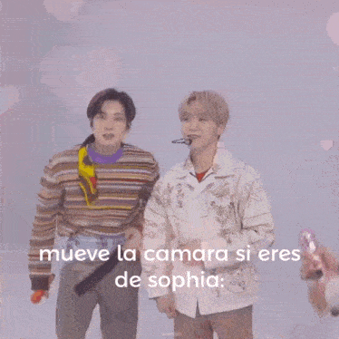 a young man wearing a striped sweater with the words mueve la camara si eres de sophia