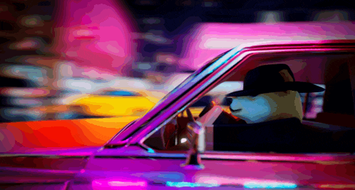 a man in a cowboy hat is sitting in a car at night