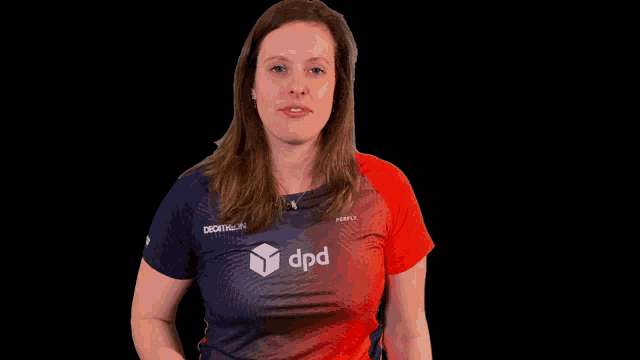 a woman wearing a red and blue shirt with dpd on it