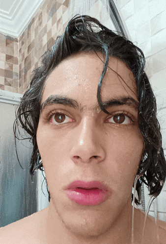 a close up of a person 's face with water coming out of it