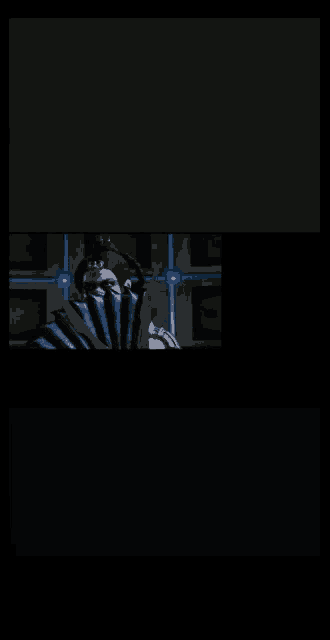 a man is holding a fan in his hand in a dark room
